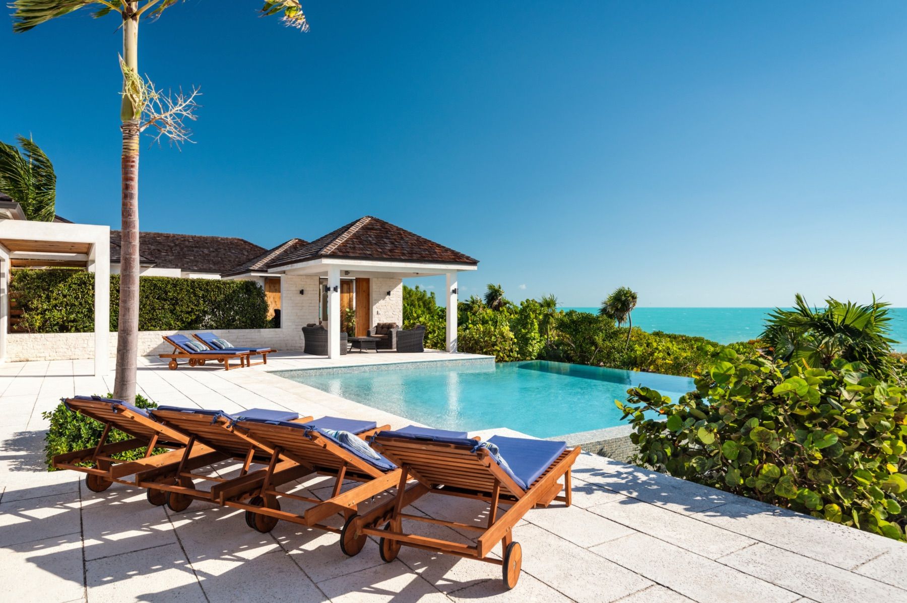 Sun loungers adjacent to the pool